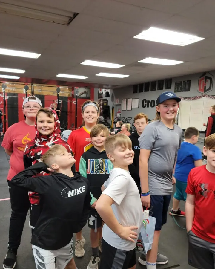 A group of CrossFit Kids athletes together after class at CrossFit Deluge.