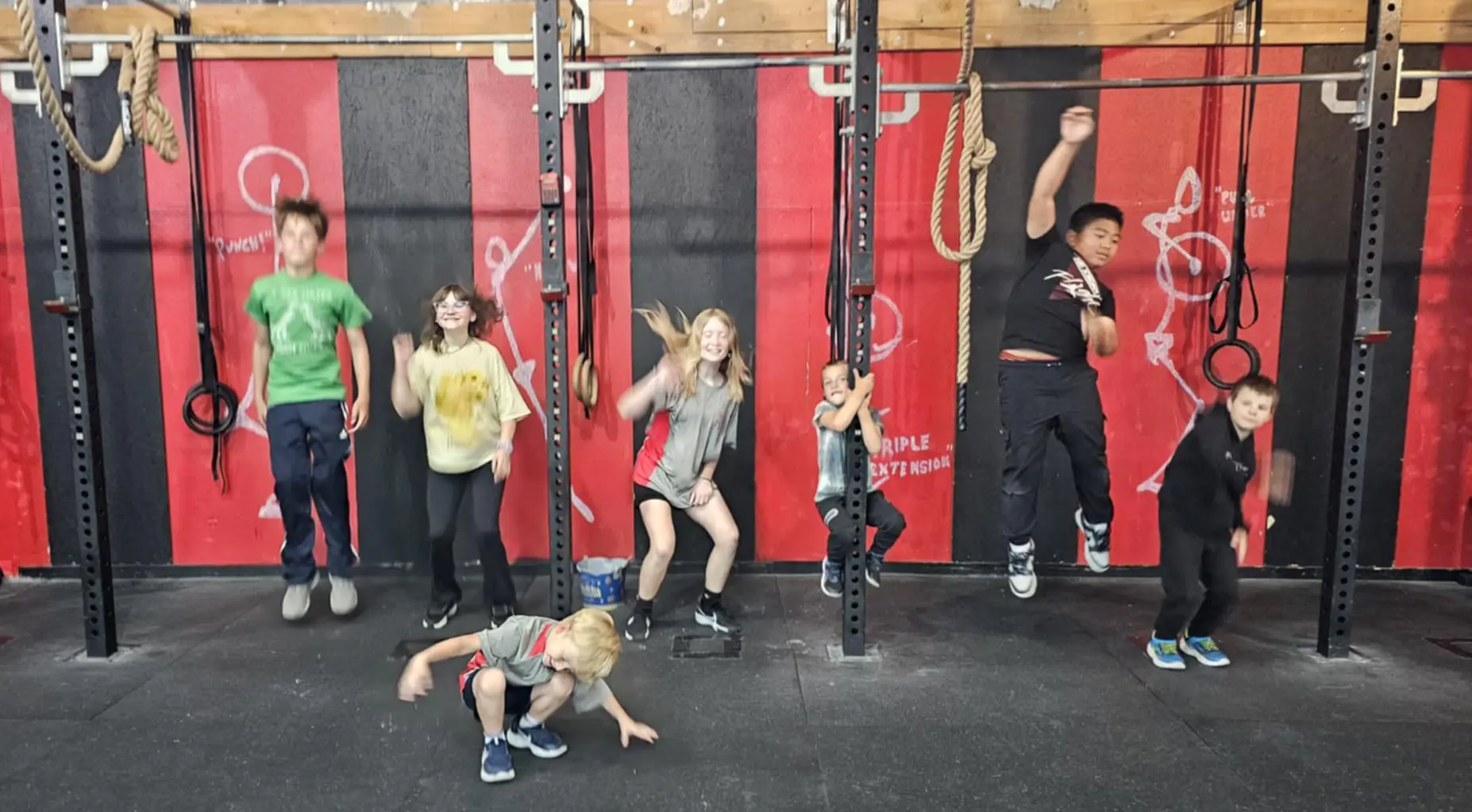 Children participating in CrossFit Kids class - age-appropriate functional movements, fun games, and building confidence through fitness