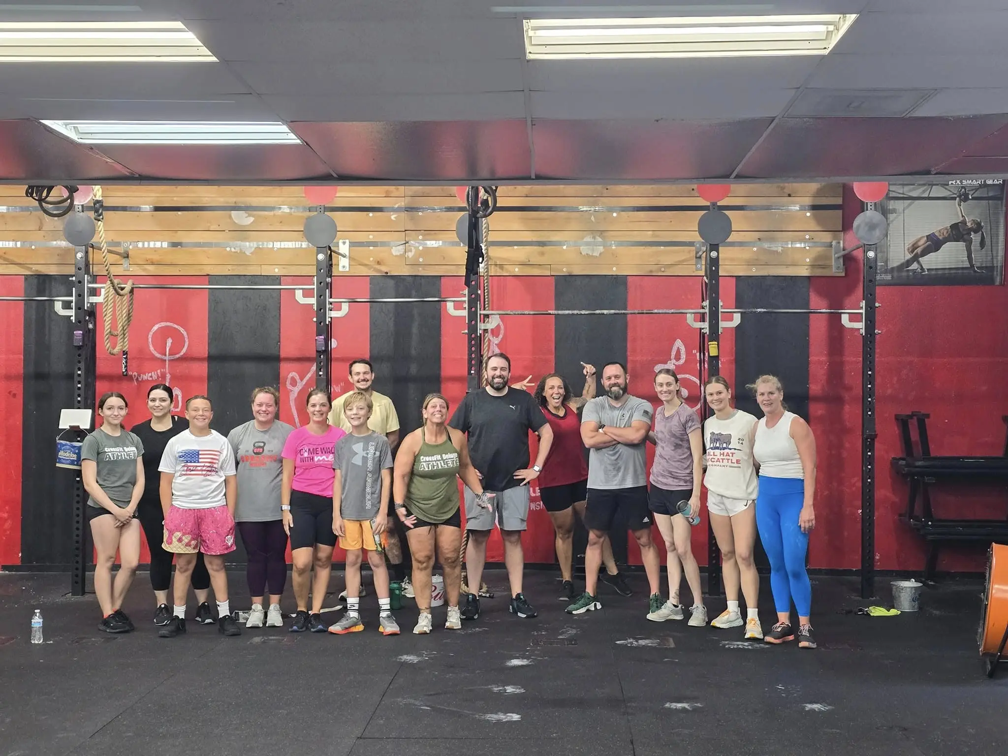 CrossFit Deluge community members working out together in a group class, showing teamwork and motivation